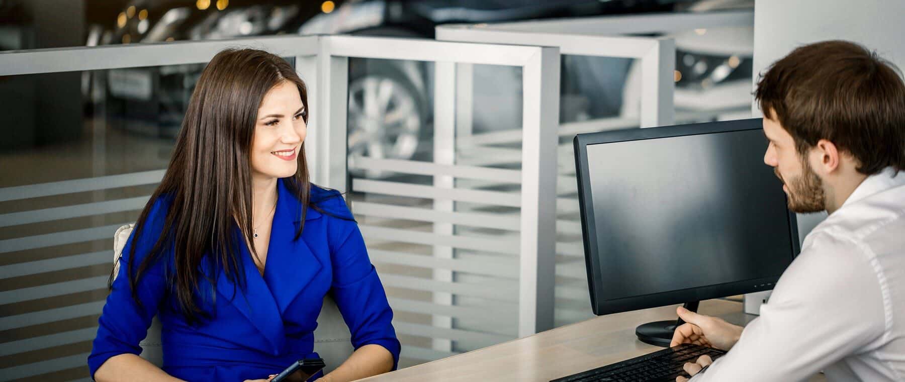 Final negotiations before sale contract in car dealership
