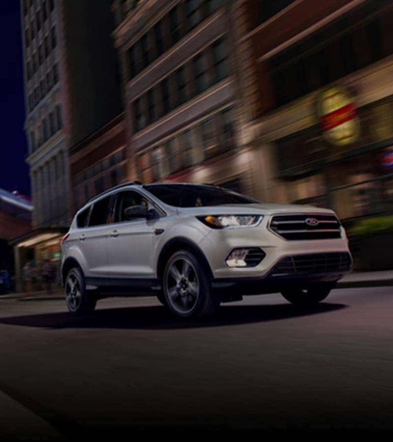 Image of a Ford Vehicle driving through the city
