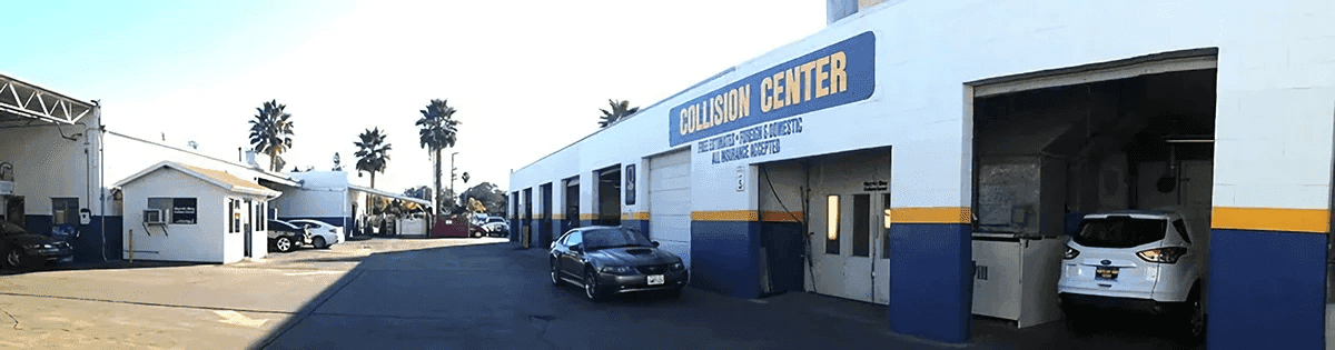 Cars parked near a collision center.