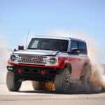 A red 2025 Ford Bronco Stroppe Edition is shown from the front at an angle.