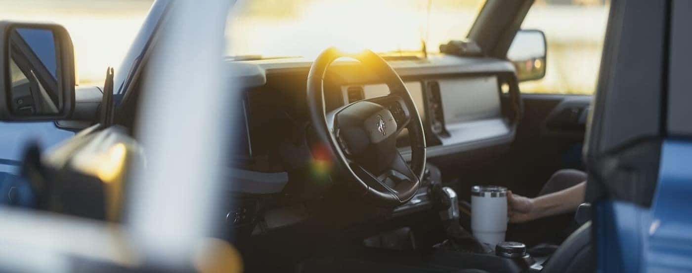 The black interior and dash in a 2025 Ford Bronco for sale.