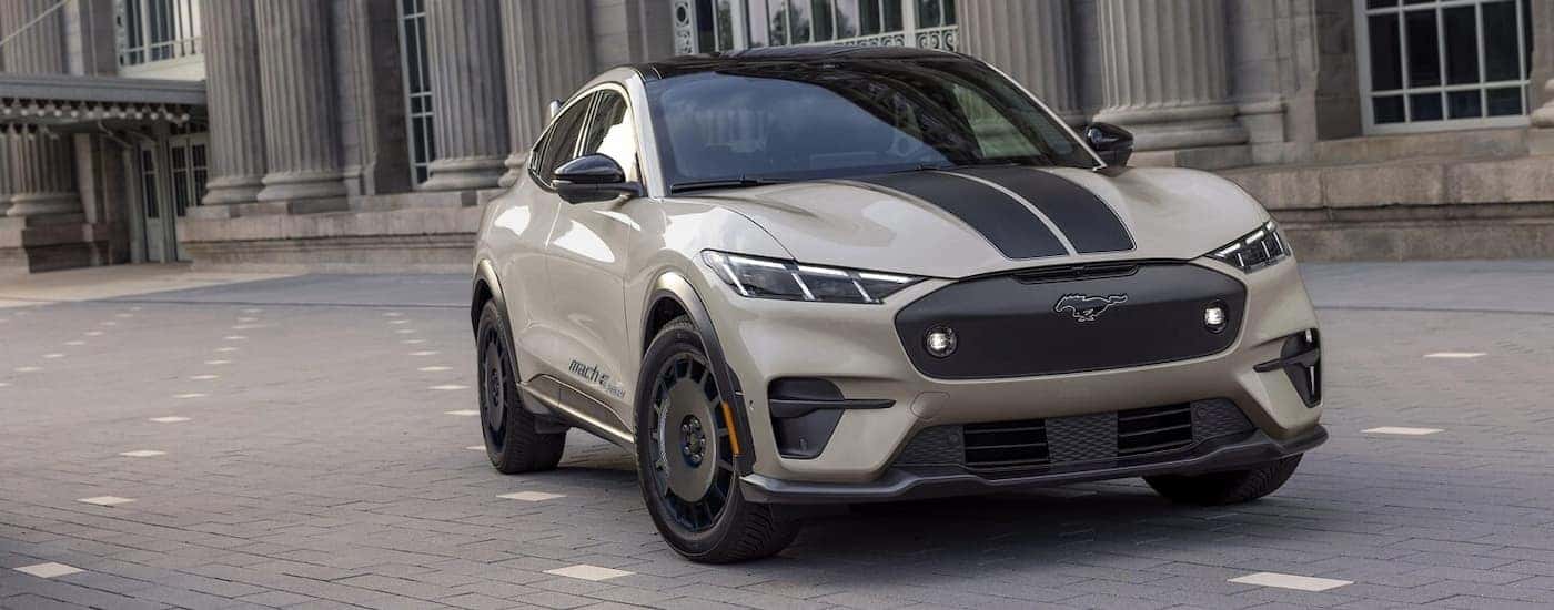 A grey 2025 Ford Mustang Mach-E Rally for sale is on a test drive.