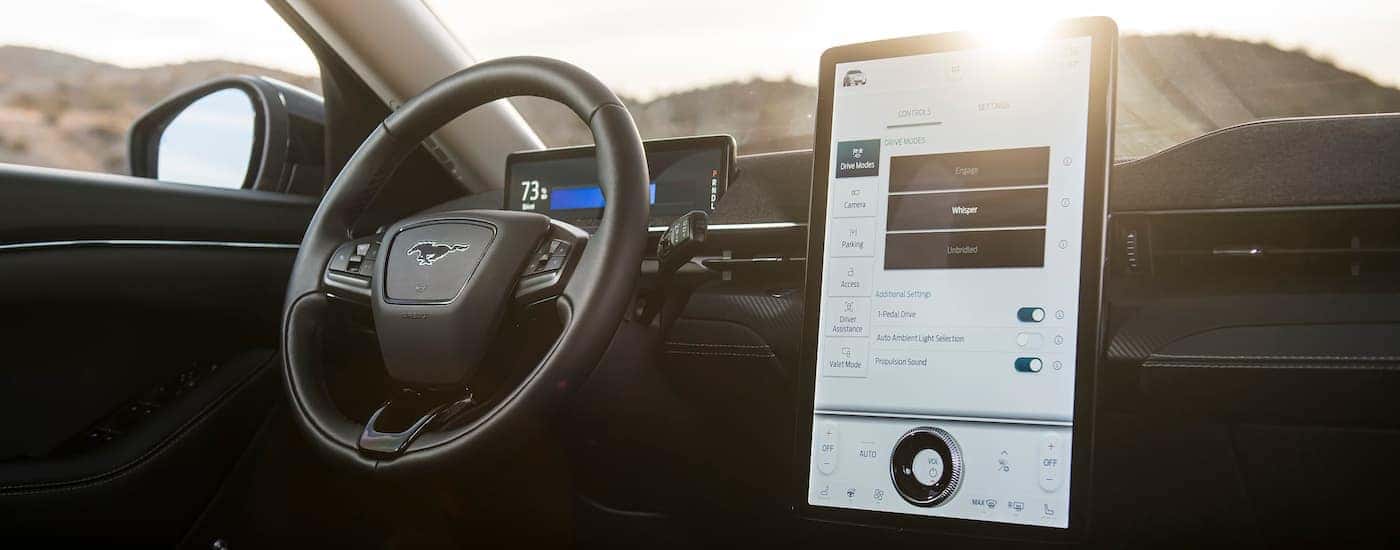 The black interior of a 2025 Ford Mustang Mach-E is shown.