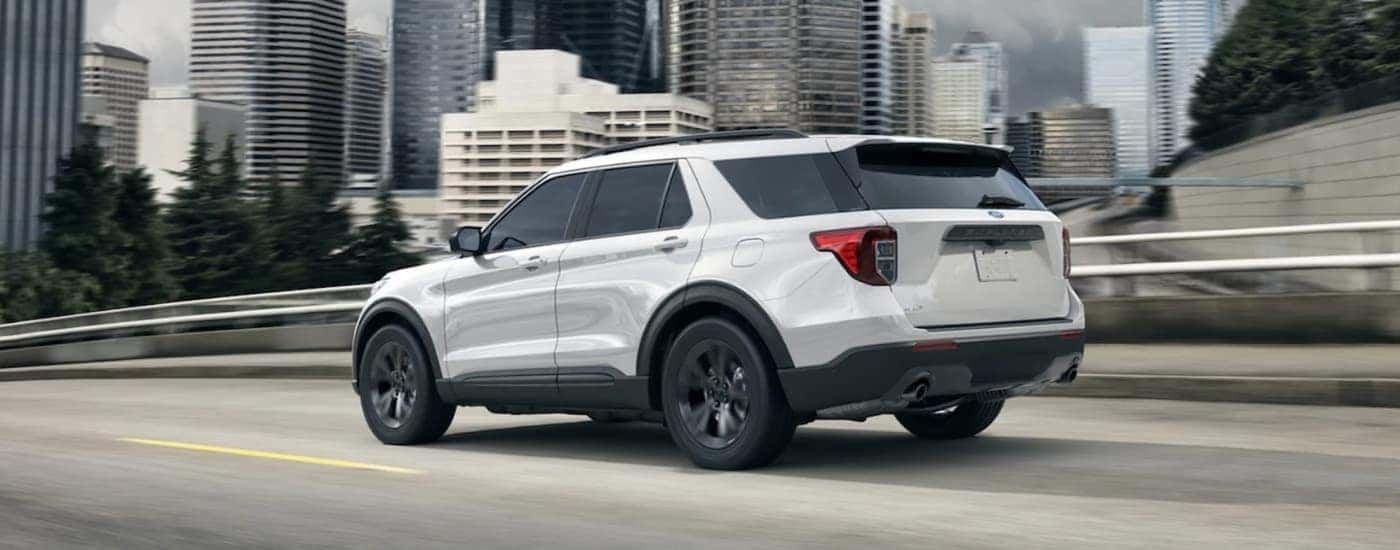 A white 2021 Ford Explorer from the side.