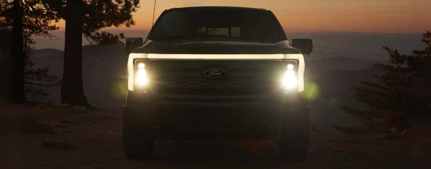 A black 2025 Ford F-150 Lightning for sale near Salinas parked at dusk.