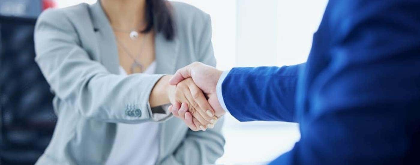 Two people shaking hands.