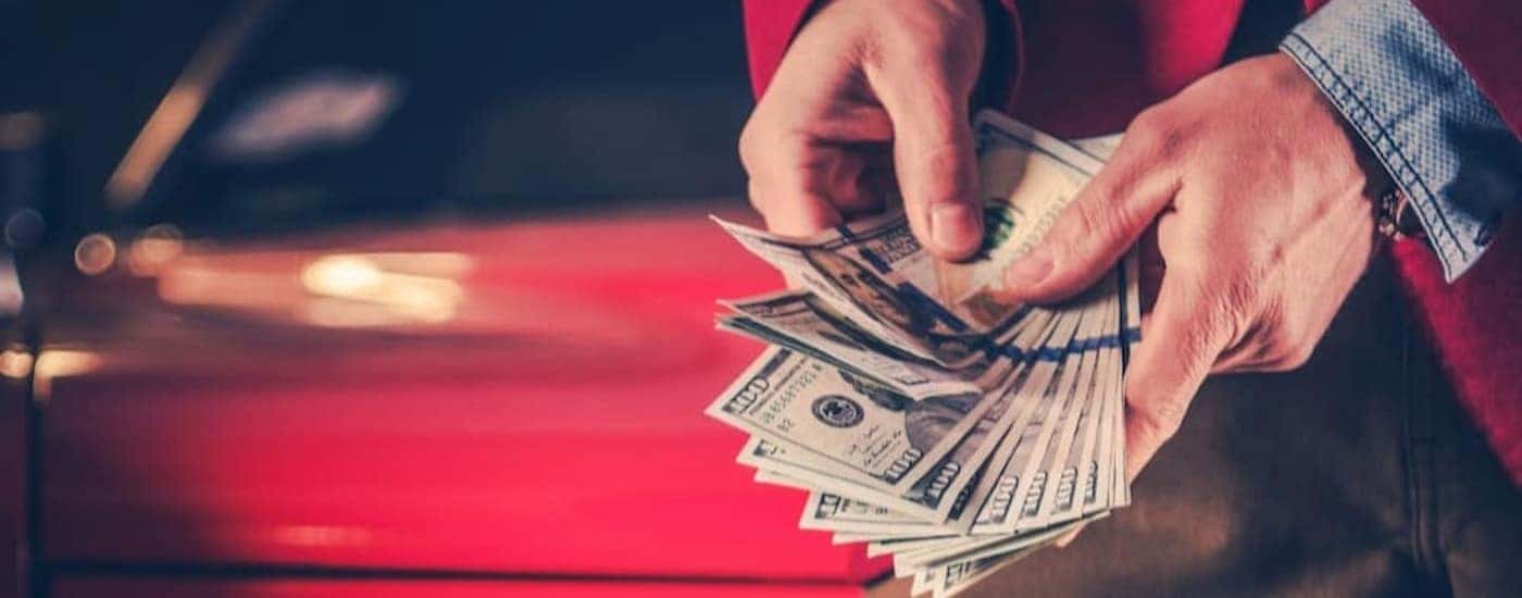 A person holding money.