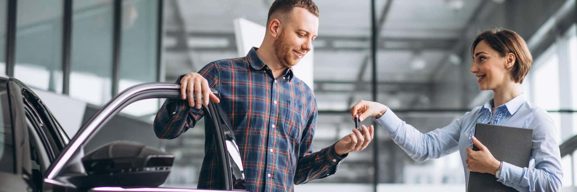 customer getting keys at dealership