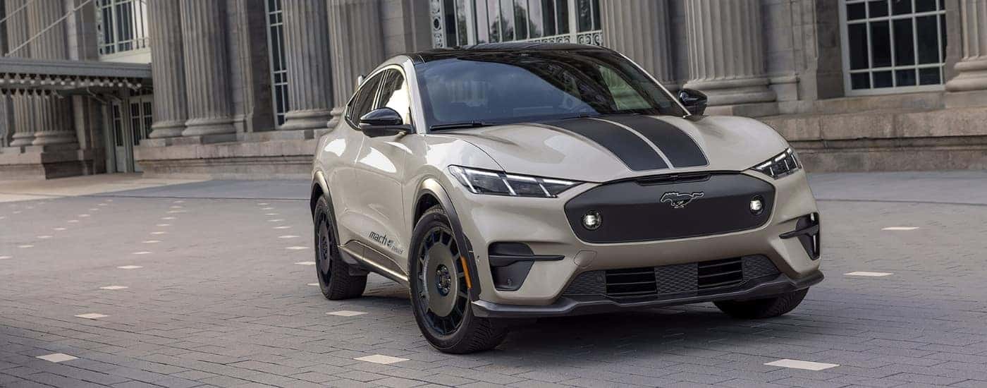 Beige and black2025 Ford Mustang Mach-E Rally parked at an angle