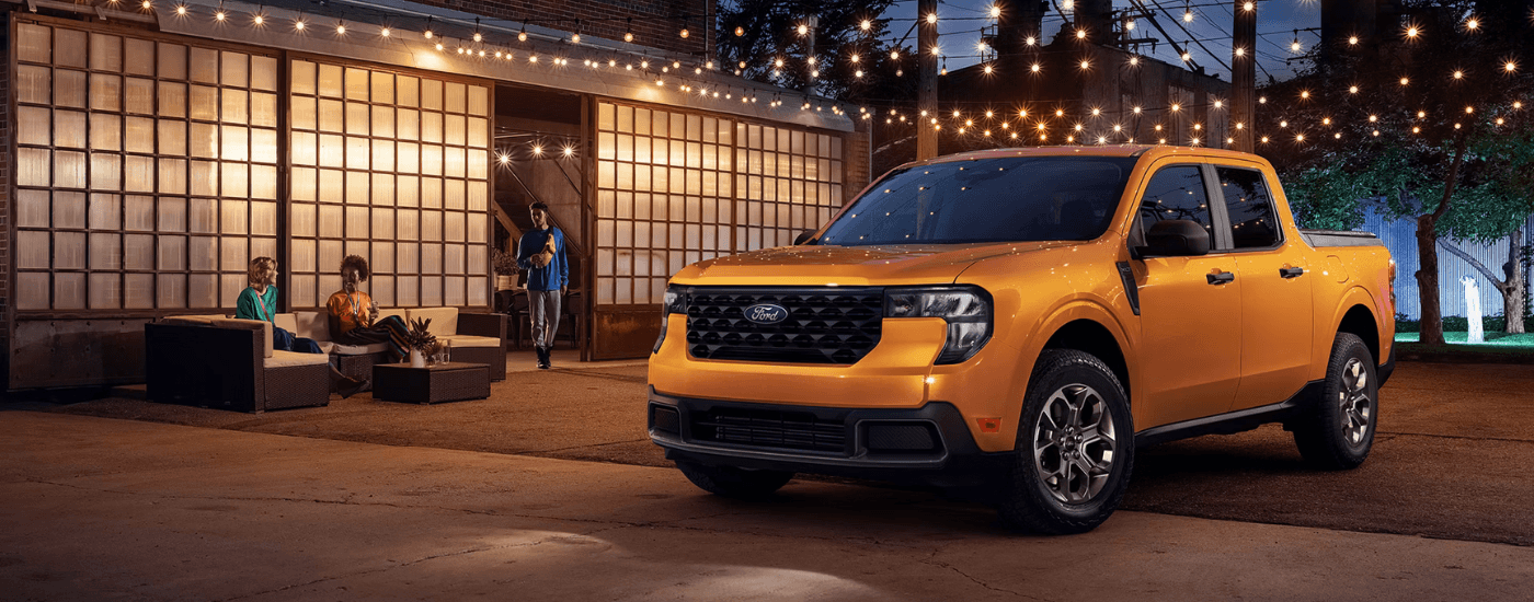 Orange 2026 Ford Maverick parked in a courtyard
