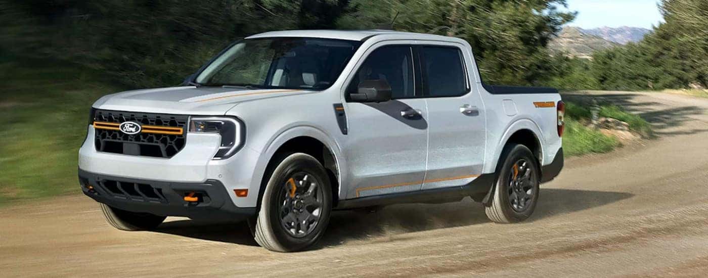 White 2026 Ford Maverick Tremor driving down a trail