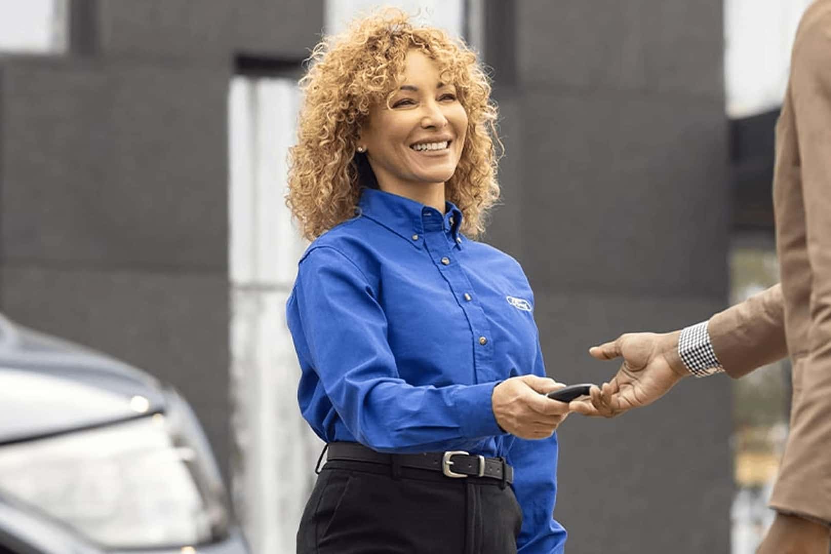 ford service tech handing keys over
