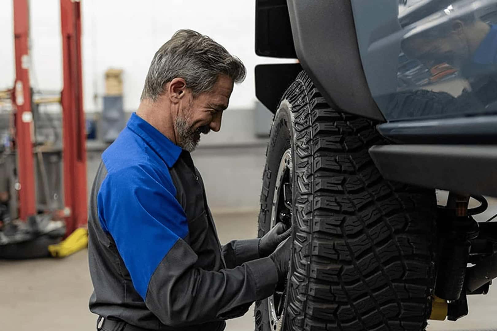 ford service tech working on tire