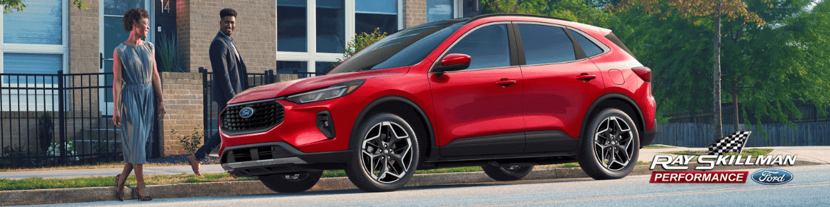 Ford Escape Whiteland, Indiana - a couple approaching their red Ford Escape