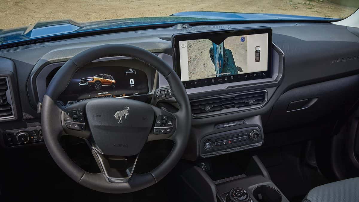 2026 Ford Bronco Sport Badlands interior showing Rock Crawl mode on the digital cluster and the G.O.A.T. Modes dial on the console