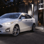 2020 Ford Fusion Titanium Trim Level parked in alley with string lights