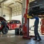 Couple of ford trucks in the service bay
