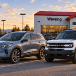 Gray Ford Escape and white Ford Bronco Sport parked in front of the Wareing dealership at 30 5th Ave