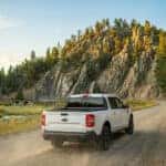 2026-Ford-maverick-driving-a-narrow-forest-road