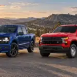 2026 Ford F-150 beside a 2026 Chevrolet Silverado 1500
