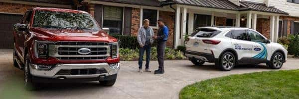 service technician with customer providing mobile ford service