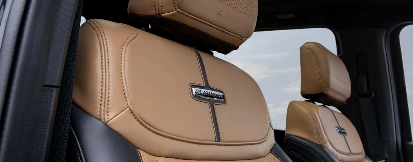 Brown and black leather front seats in a 2023 Ford F-150 Platinum