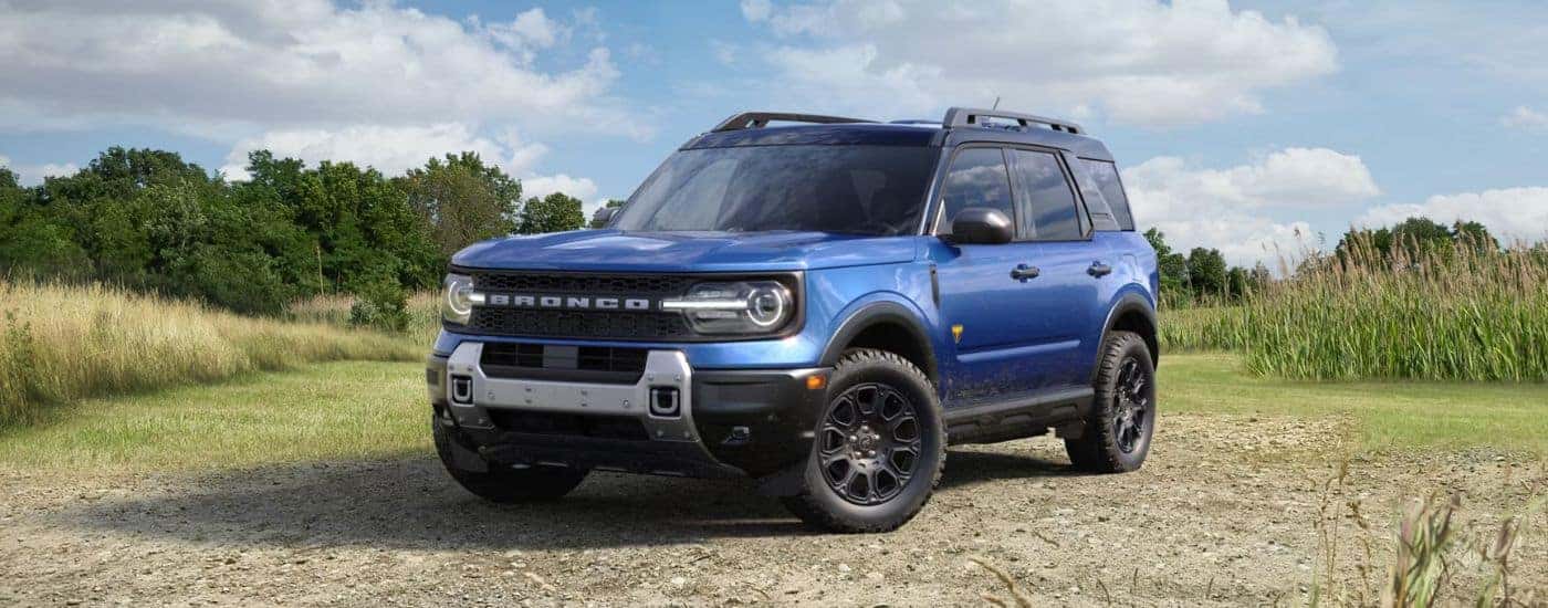 Blue 2026 Ford Bronco Sport parked in a field.