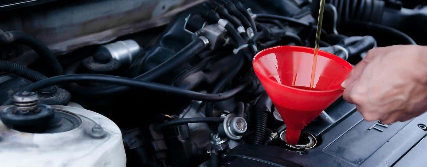 Oil change service being performed on a vehicle.