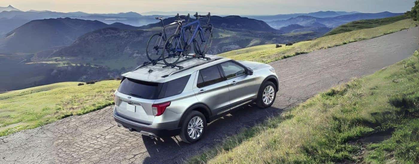 Silver 2022 Ford Explorer driving on a trail.