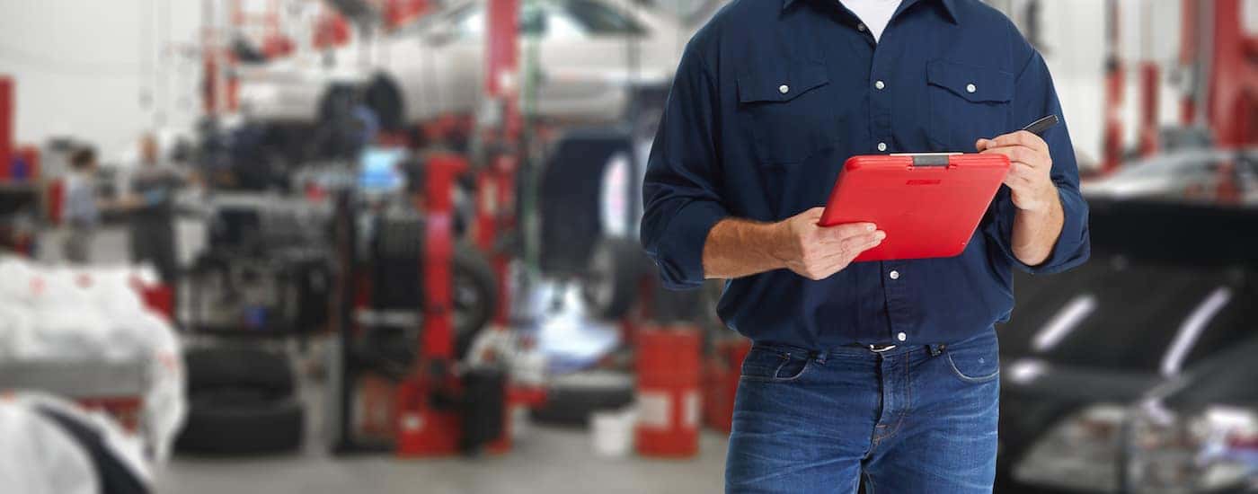 A service technician holding a clipboard.