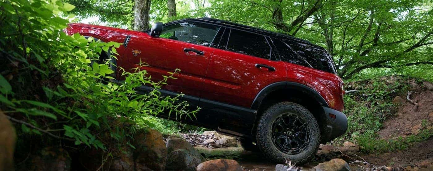 A red 2026 Ford Bronco Sport off-roading.