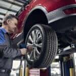 Rapid Red Metallic Ford SUV wheel alignment