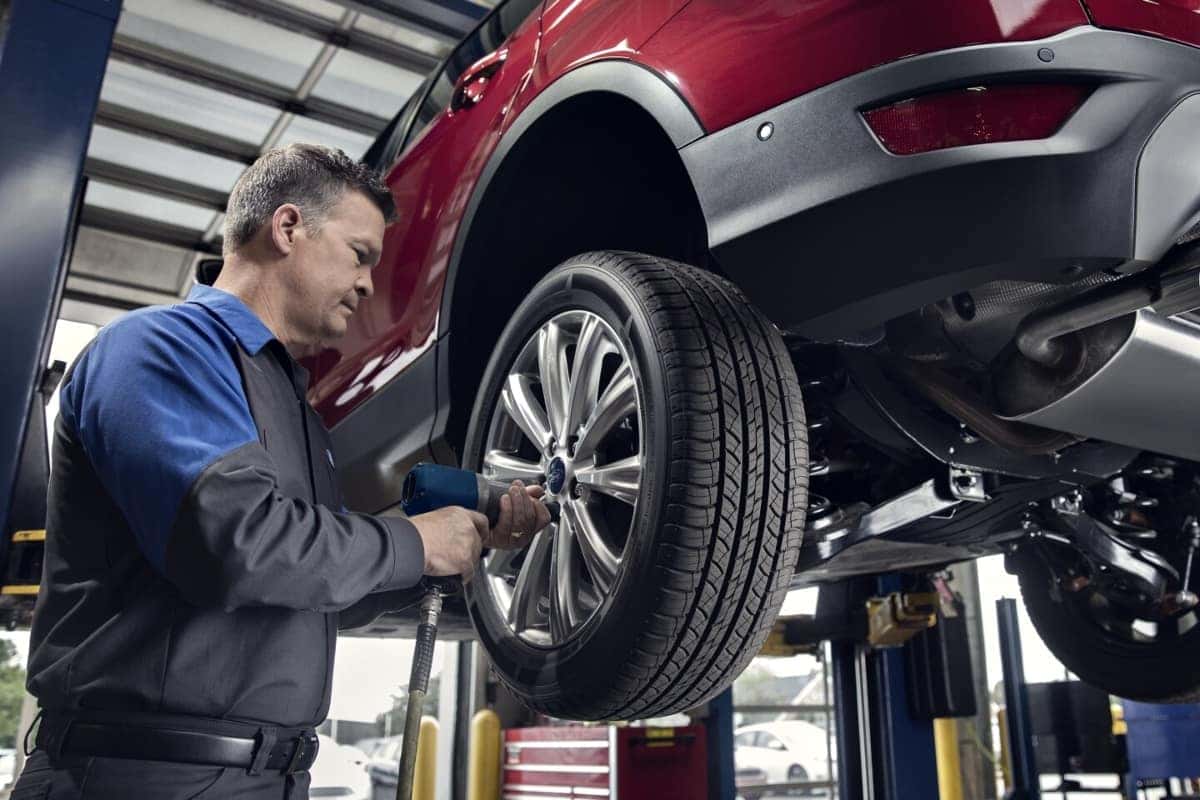 Rapid Red Metallic Ford SUV wheel alignment