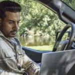 2025-ford-f150-man-on-laptop