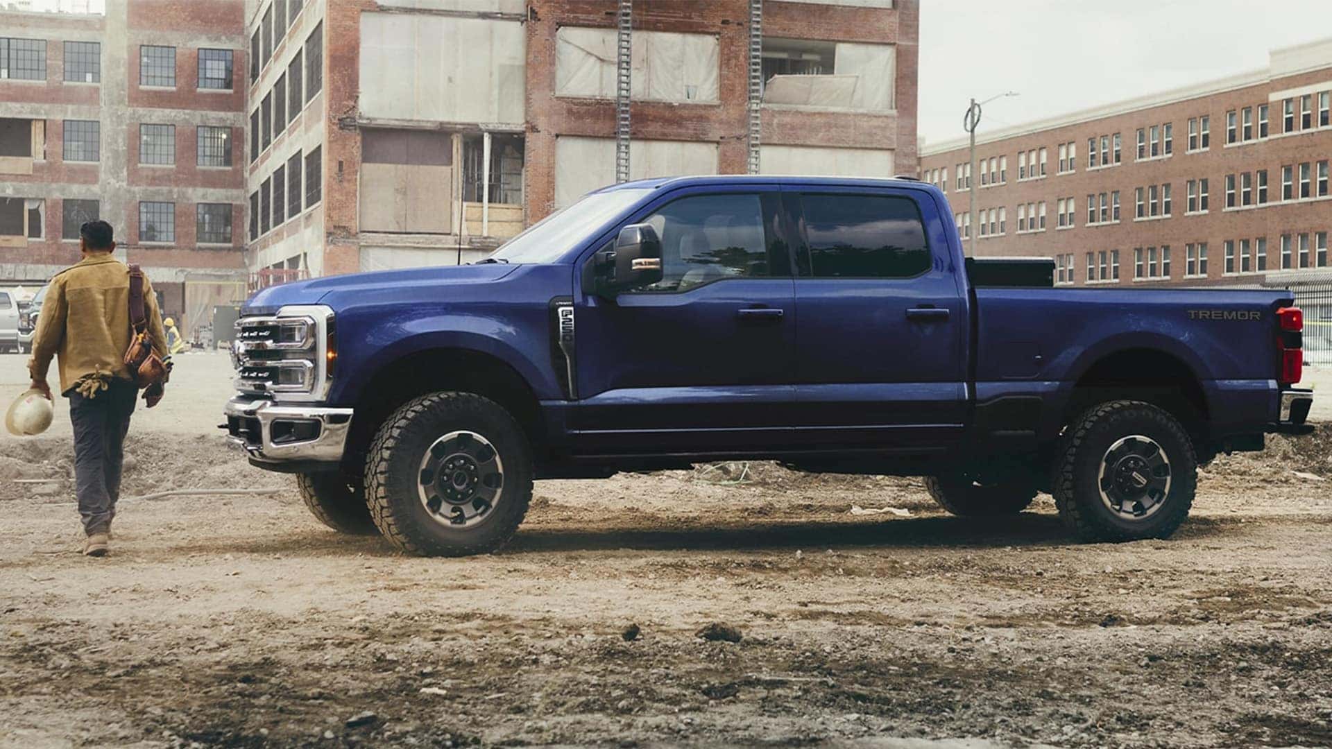 Man Walking Through Construction Site with 2026 Ford Super Duty