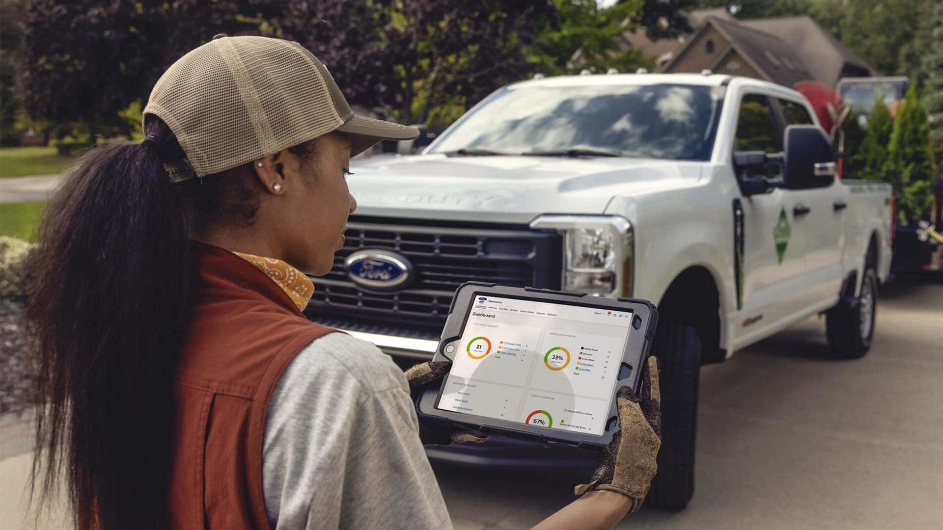 Woman with Tablet Looking at Data for 2026 Ford Super Duty