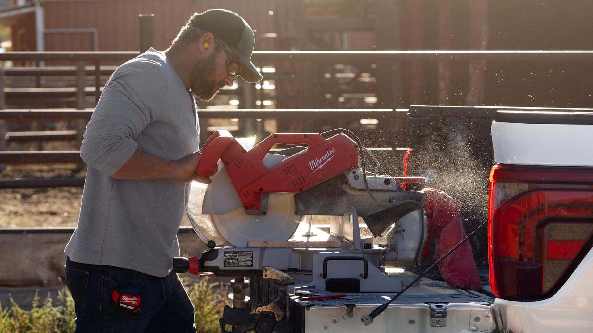Man with wood cutting tools in the back of 2026 Ford F 150