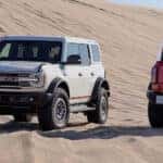 Side-view-of-white-bronco-with-red-bronco-next-to-it