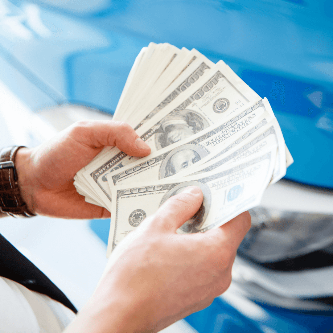 guy counting his money from selling his car to Susquehanna Ford