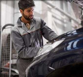 Technician Working On Vehicle
