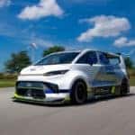 exterior shot of the ford ev super van iv on a circuit racing track