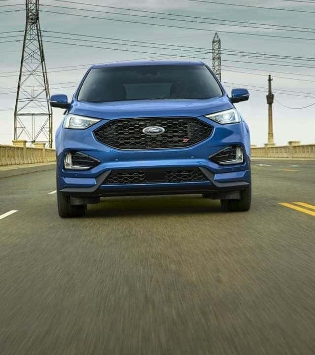 Head-on view of blue Ford car