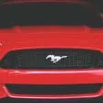 Front close up view of a Ford Mustang Mach E in color red.