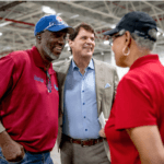 Ford and DTE employees discuss clean energy agreement together